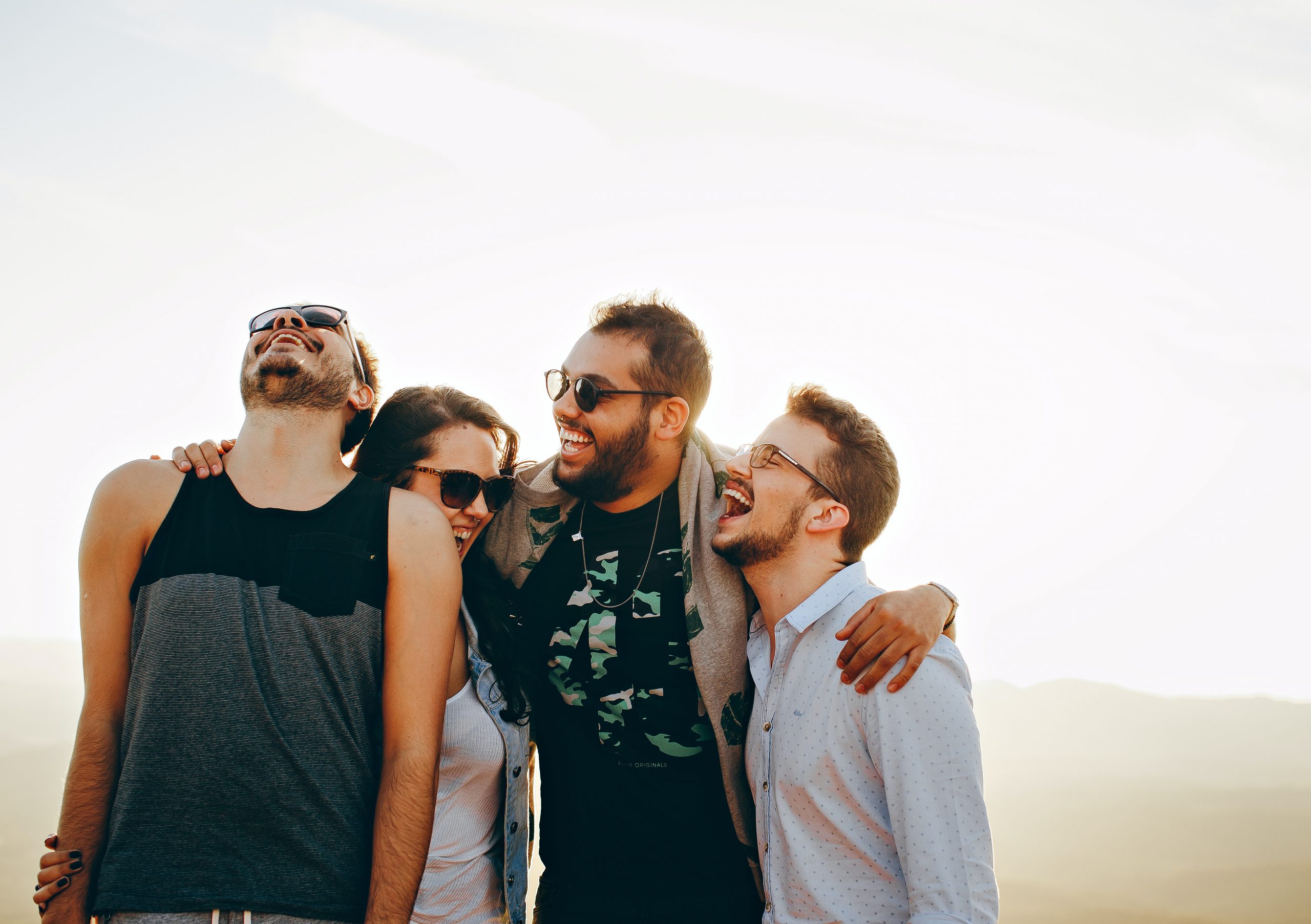 Four people laughing