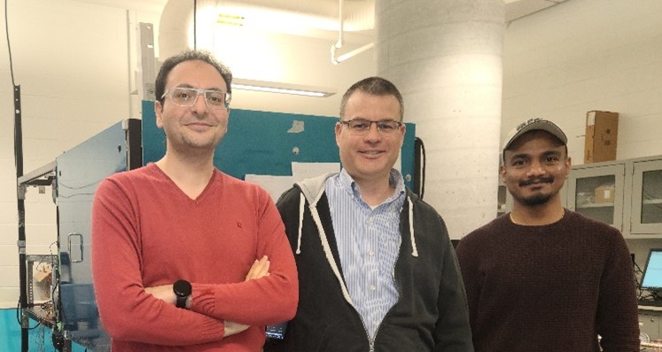 Professor Paul O’Brien posing in his Advanced Materials for Sustainable Energy Technologies Laboratory (AM-SET-Lab) with Dr. Nima Talebzadeh, postdoctoral researcher and Tanay Sahu, PhD candidate.