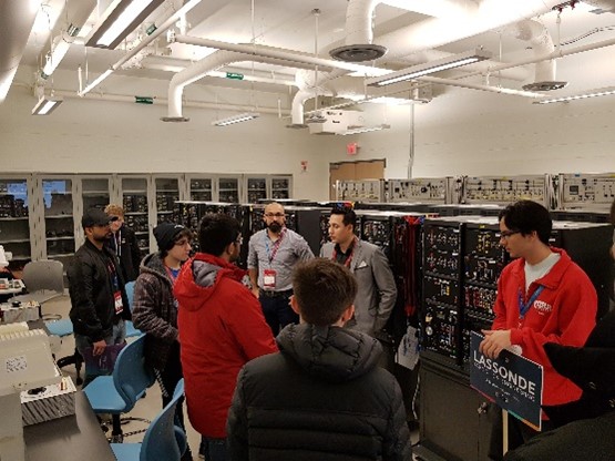 Professor Farag giving a tour and demo of his lab facility to high school students attending an open-house event 
