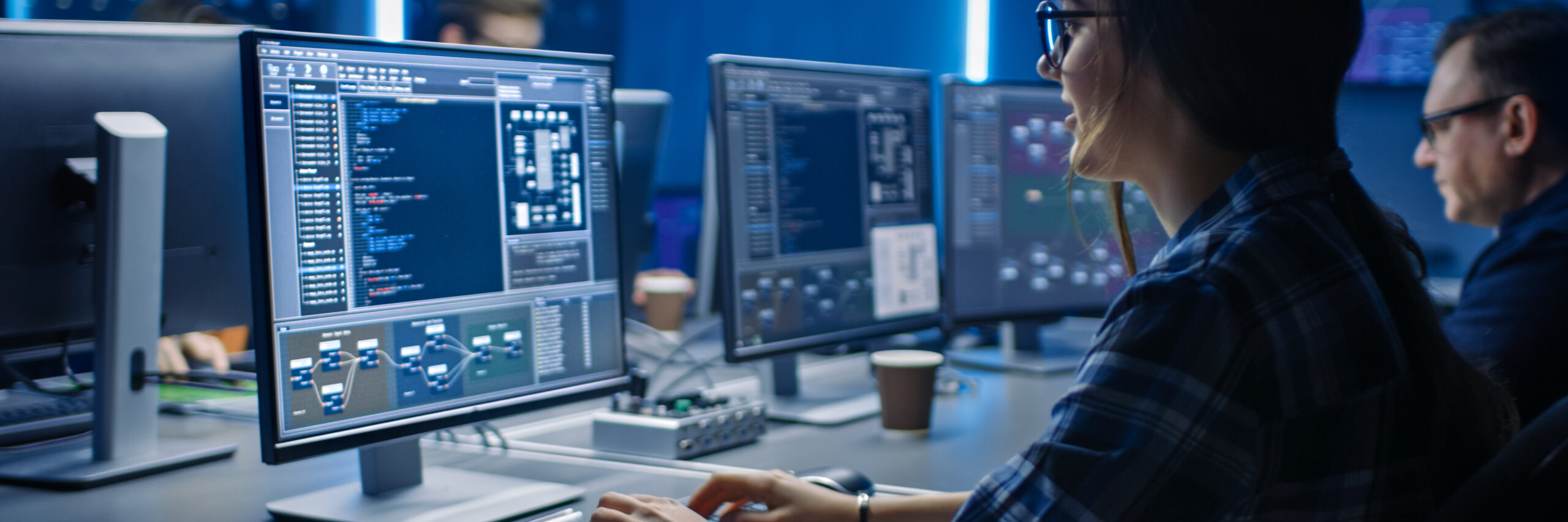 Two people working on computer