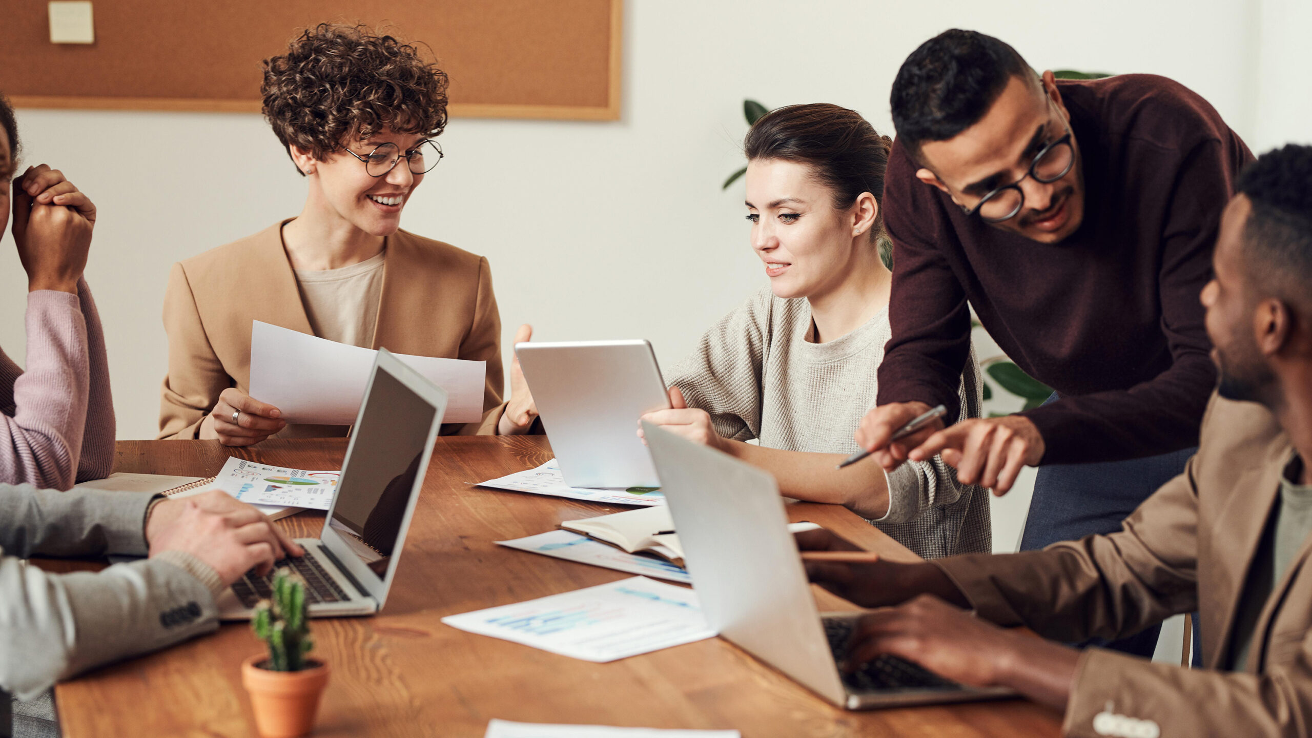 diverse group of business people discussing a project while sitting in a meeting