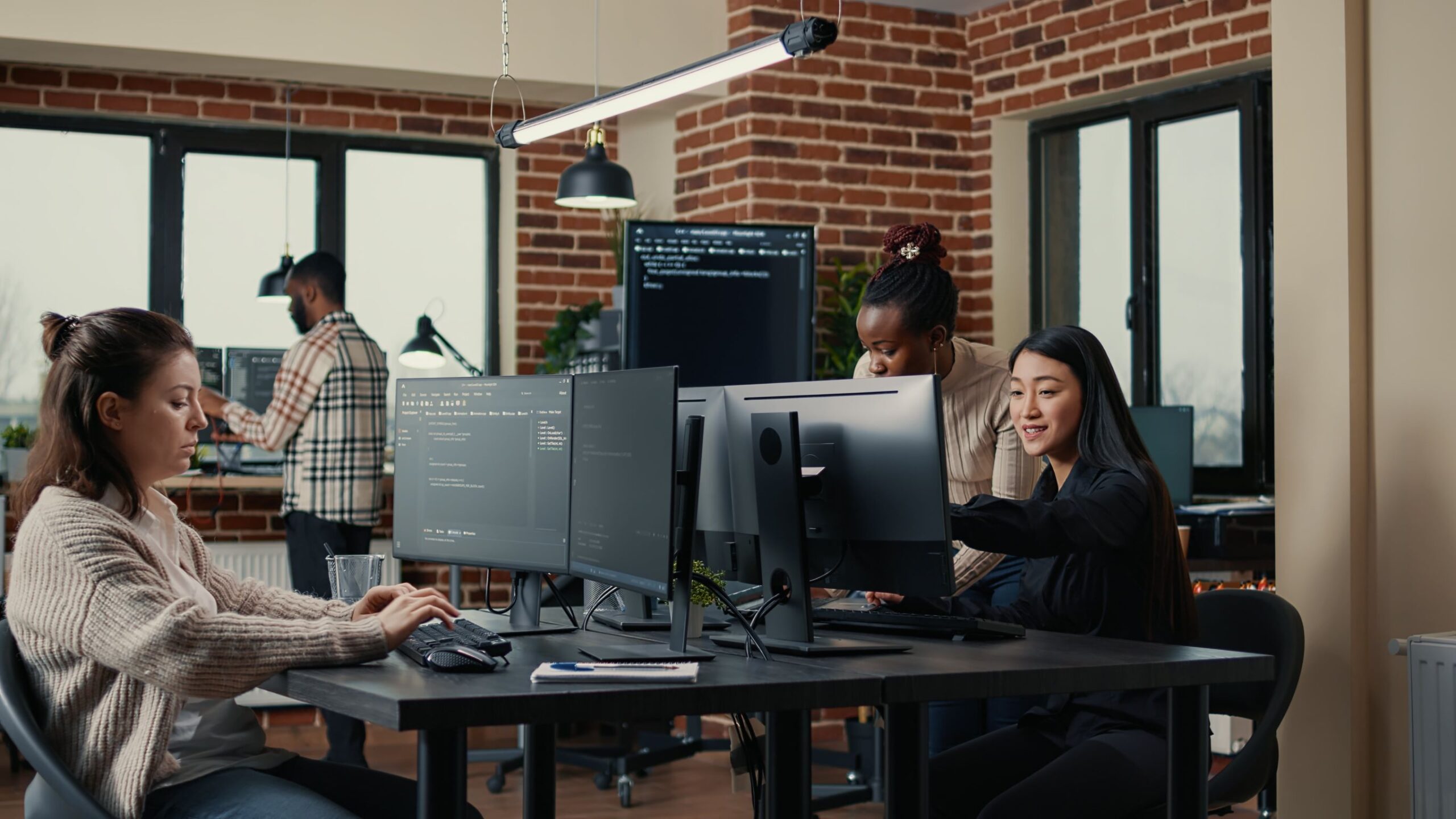 software engineer typing source code on computer