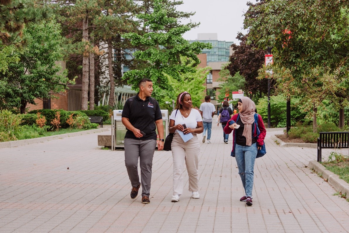 Three students walking in campus