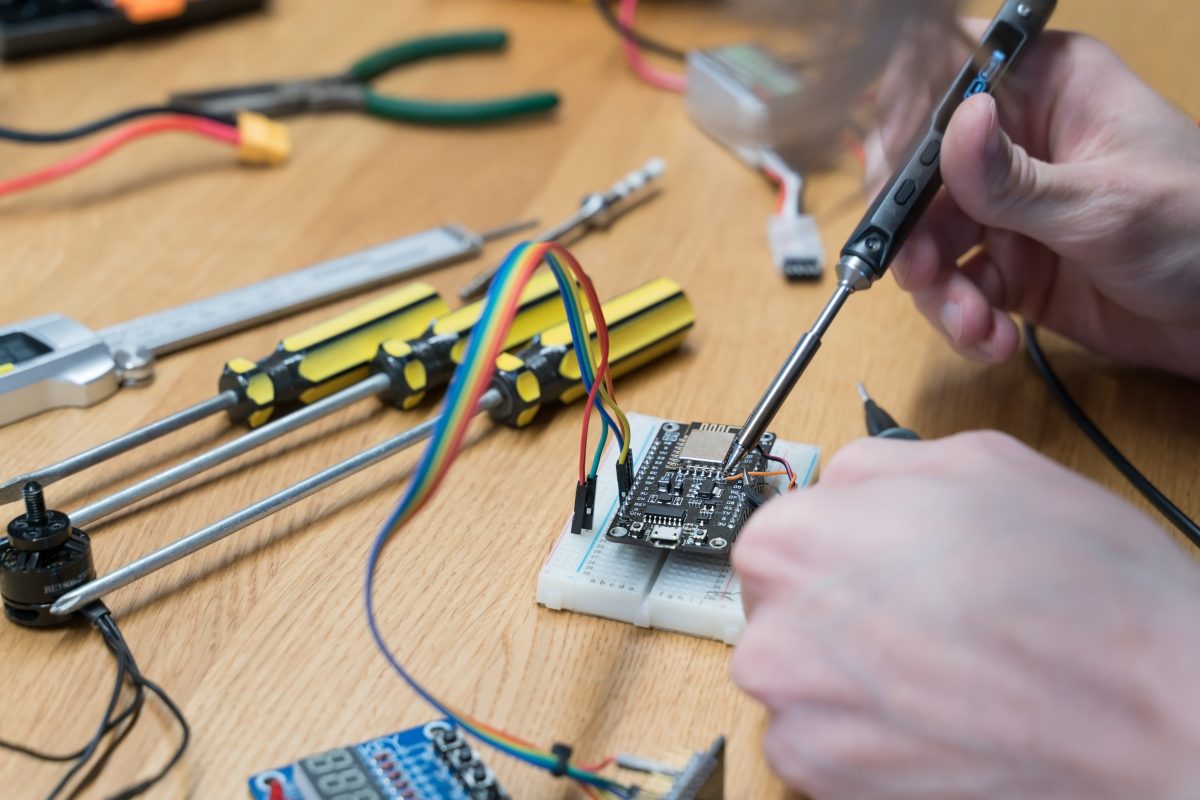 Person works on electronics