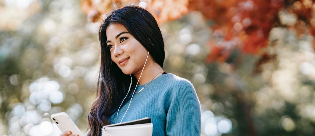 Smiling student walking outside