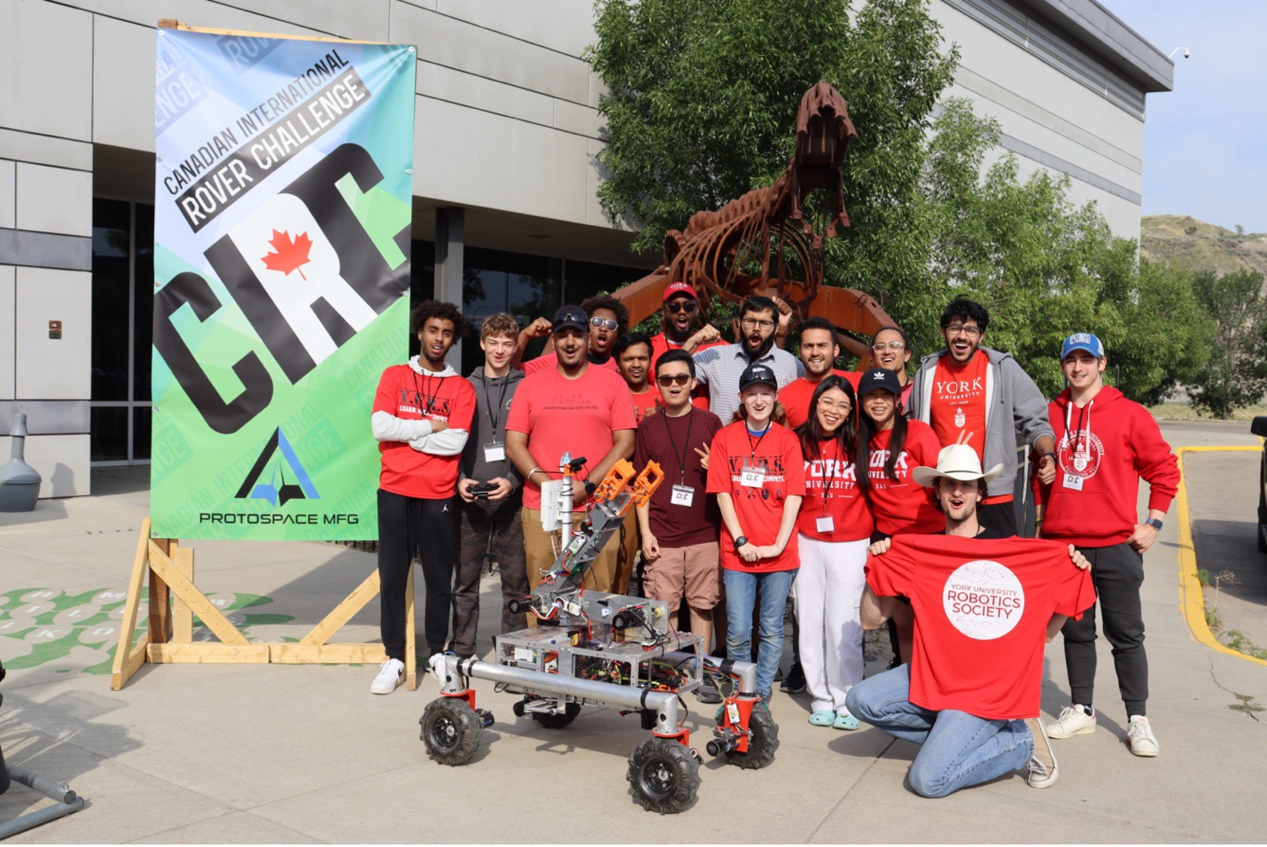 York University Robotics Society team posing with their rover robot at Canadian International Rover Challenge