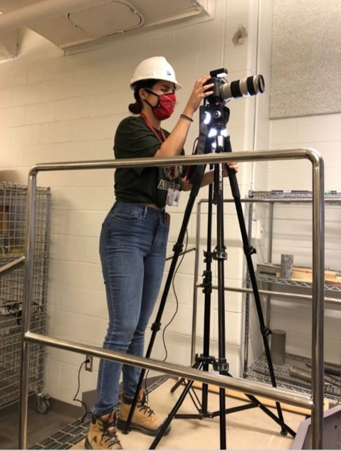 Zoi Ralli setting up the camera for Digital Image Correlation of her electromechanical testing